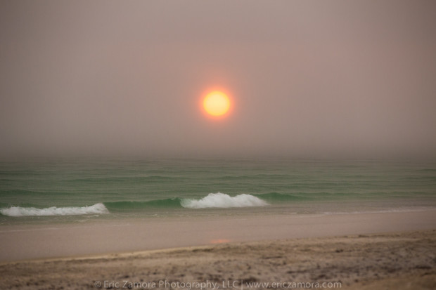 An eerie and surreal sunset through falling rain. Anna Maria Island, Holmes Beach, Bradenton, Florida.